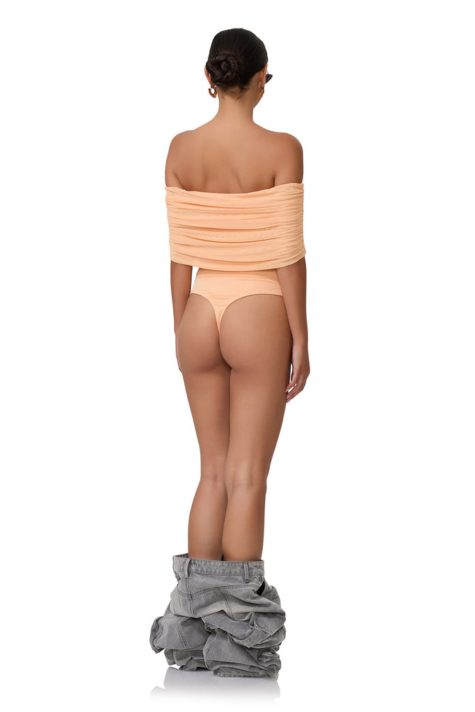 women's off the shoulder bodysuit with gathering detail across the chest in peach fuzz 