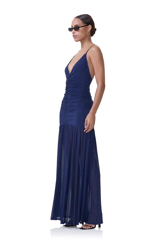 women's lowcut dress with drop waist, rouching on the body, and wide sweep and rhinestone details in bright navy